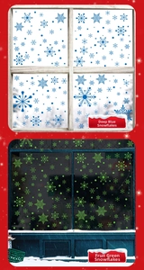 Detail of dark blue and fruit green snowflake static window stickers for Christmas decor