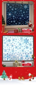 Detail of gradient blue and starry blue snowflake static window stickers on red background