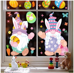 Close-up of Easter window stickers with cartoon gnomes, colorful eggs, and bunny patterns