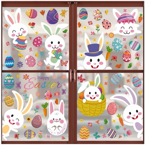Detail of Easter window decals with Happy Easter text and cartoon bunnies on glass doors