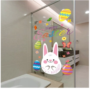 Close-up of Happy Easter window stickers featuring bunnies and eggs on a glass surface