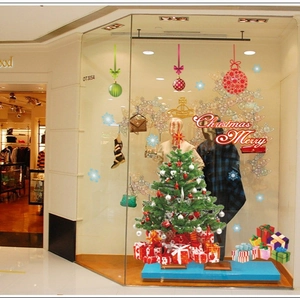 Christmas window stickers featuring a green Xmas tree with colorful gift boxes and festive baubles