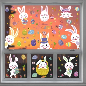 Cartoon Easter bunny and colorful egg window clings with Happy Easter greeting on glass