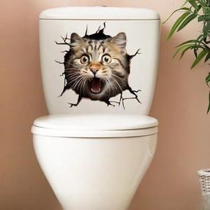 Detailed view of a cute 3D cat wall sticker in a broken hole effect on a white toilet lid