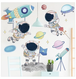 Detailed wall sticker set showing astronauts, rockets and planets in a nursery room