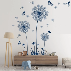 Blue dandelion wall decal displayed in a modern living room setting with butterflies