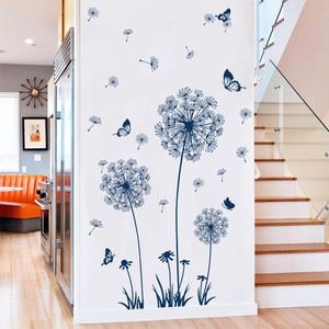 Blue dandelion wall decal with butterflies shown in a modern living room setting