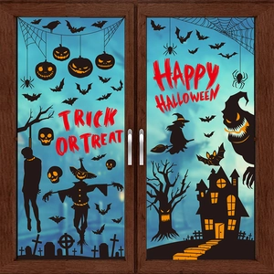 Halloween window silhouettes with pumpkins, bats and ghosts on wood frame glass