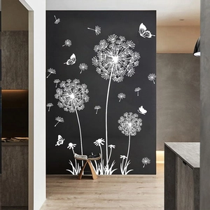 White dandelion and butterfly wall decal on dark wall for minimalist bedroom decor