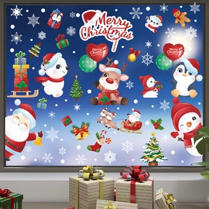 Detailed Christmas window decals featuring Santa, reindeer, and snowflakes on glass