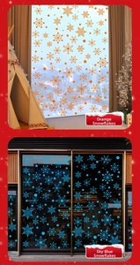 Detail view of snowflake window decals in vibrant orange and sky blue festive designs