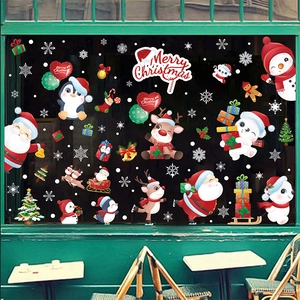 Detailed Christmas window stickers with Santa, reindeer, and snowflakes on glass
