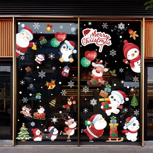 Detailed Christmas window decals featuring Santa, reindeer, and snowflakes on glass doors