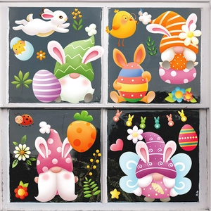 Easter gnome window stickers with rabbits and eggs on a white cross window pane