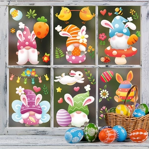 Detailed view of Easter gnome and bunny window clings on glass with a decorative egg basket