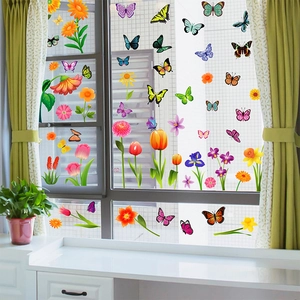Detailed view of spring flower and butterfly static window clings on home glass