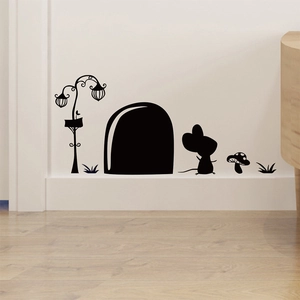 Detail of black silhouette wall stickers with mouse hole, street lamp and grass patterns