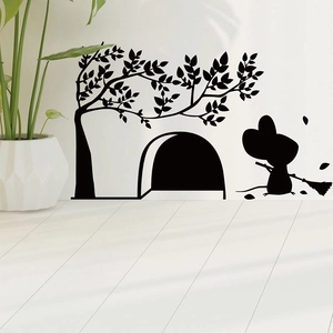 Detail of cute mouse silhouette wall sticker on baseboard with sweeping mouse and tree branch