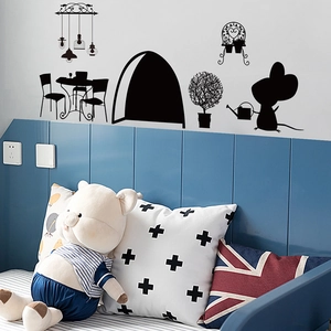 Detail of cute mouse silhouette wall stickers used as baseboard decor in a cozy bedroom