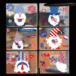 Independence Day window clings featuring gnomes and USA flags on glass pane