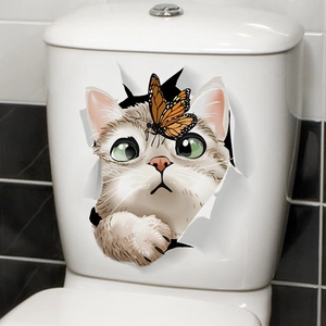 Detailed view of a 3D cat and butterfly waterproof wall decal on a white toilet surface