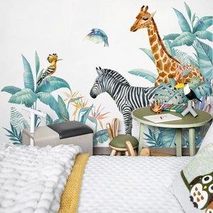Detail of watercolor jungle wall decals featuring giraffes and zebras in a kids bedroom