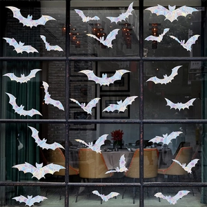 Halloween bat suncatcher window clings with 3D rainbow prism effect on glass door