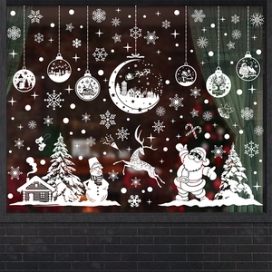 Detailed white Christmas window decals featuring Santa, reindeer, and festive hanging ornaments