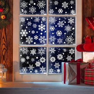 Close-up of white snowflake static window stickers for Christmas and winter home decor