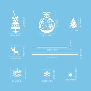 Detailed view of white Christmas window stickers with specific dimensions for each decal