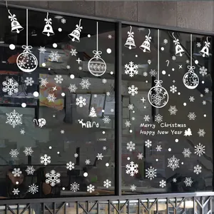 Detailed white Christmas window stickers with snowflakes, bells, and holiday greetings