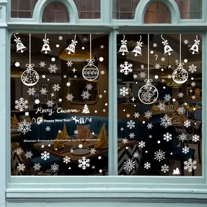 Detailed white Christmas window decals featuring snowflakes, bells and festive greetings