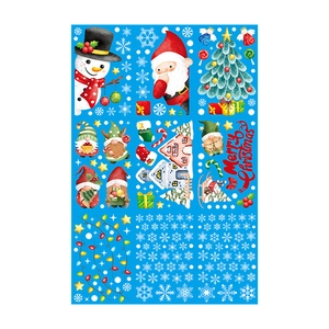 Close-up of Christmas window stickers featuring Santa, snowman, and holiday gnomes