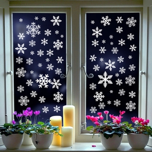 White Christmas snowflake window stickers in various sizes for festive glass decoration