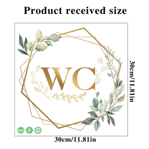 Detail view of PVC bathroom sign sticker with green plants and gold WC lettering