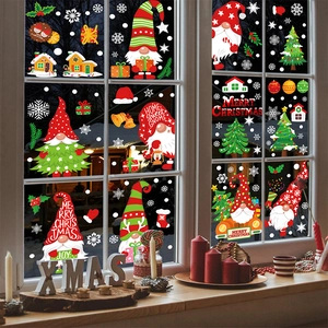 Christmas window decals set with cartoon gnomes and snowflakes on a glass window