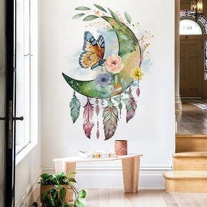 Watercolor moon and butterfly wall sticker displayed above a wooden bench in a bright room