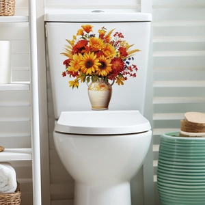 Detail of floral toilet sticker featuring sunflowers and a vase on a white bathroom tank