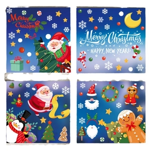 Christmas window clings set with Santa, Gingerbread Man, and Penguin on blue night sky