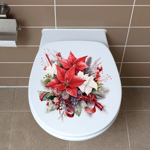 Close-up of festive Poinsettia and pinecone decal on a white toilet lid cover