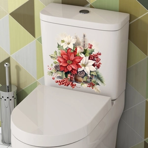 Detail of Christmas toilet tank sticker featuring poinsettia, pine cones and red berries