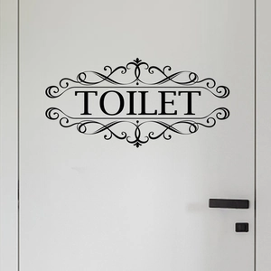 Matte black European style toilet sign sticker with vintage floral frame on a white door