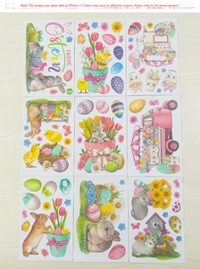 Flat lay of nine Easter window sticker sheets featuring colorful bunnies and festive eggs
