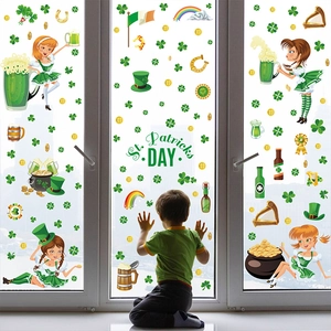 Detail of St. Patrick's Day window stickers featuring Leprechaun girl and beer on glass