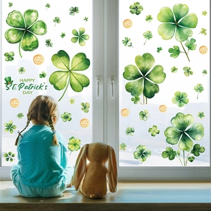 Watercolor four-leaf clover and gold coin window stickers for St. Patrick's Day decor