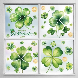 Watercolor St. Patrick's Day window decals with clovers and gold coins on white window