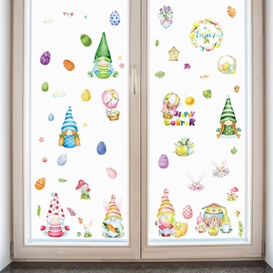 Easter window clings set with watercolor gnomes and colorful eggs on glass window