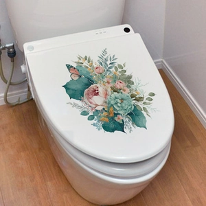Close-up of floral toilet seat decals featuring watercolor butterflies and peonies