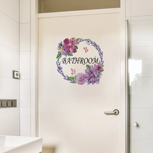 Floral bathroom door sticker with purple wreath design and black lettering on white background