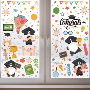 Detail of graduation window clings with cartoon gnomes and Congrats GRADUATES text